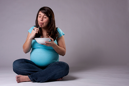 Pregnant Woman Eating Ice Cream