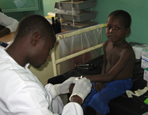 A boy receives a malaria vaccine. [NIAID]