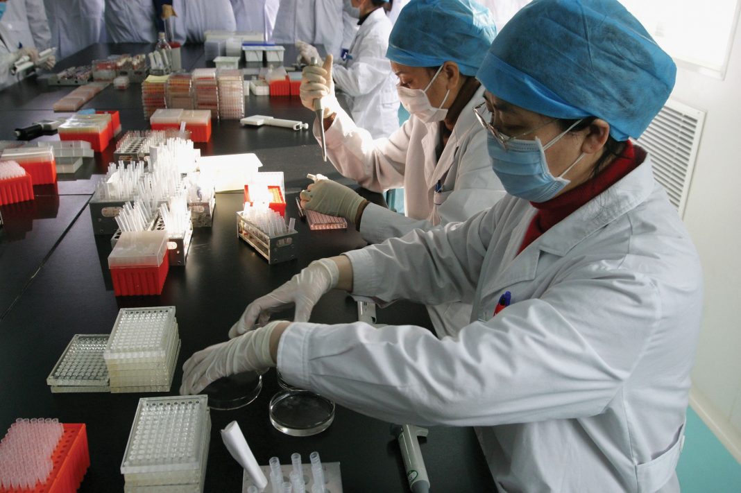Asian scientists in a lab