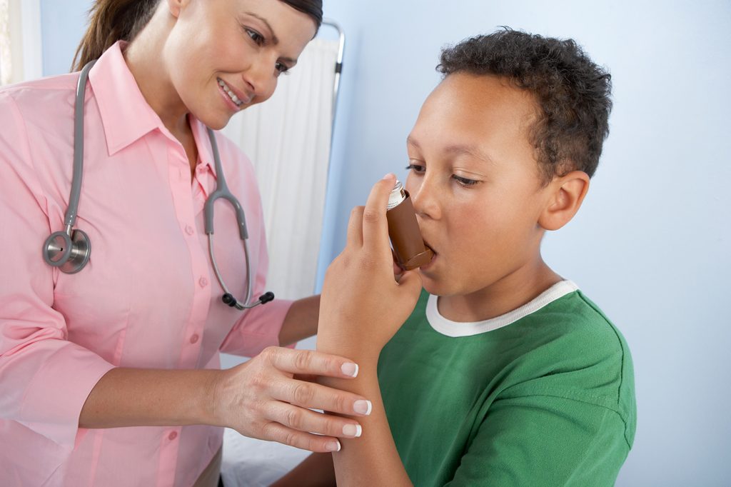 nurse and boy with inhaler
