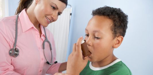 nurse and boy with inhaler