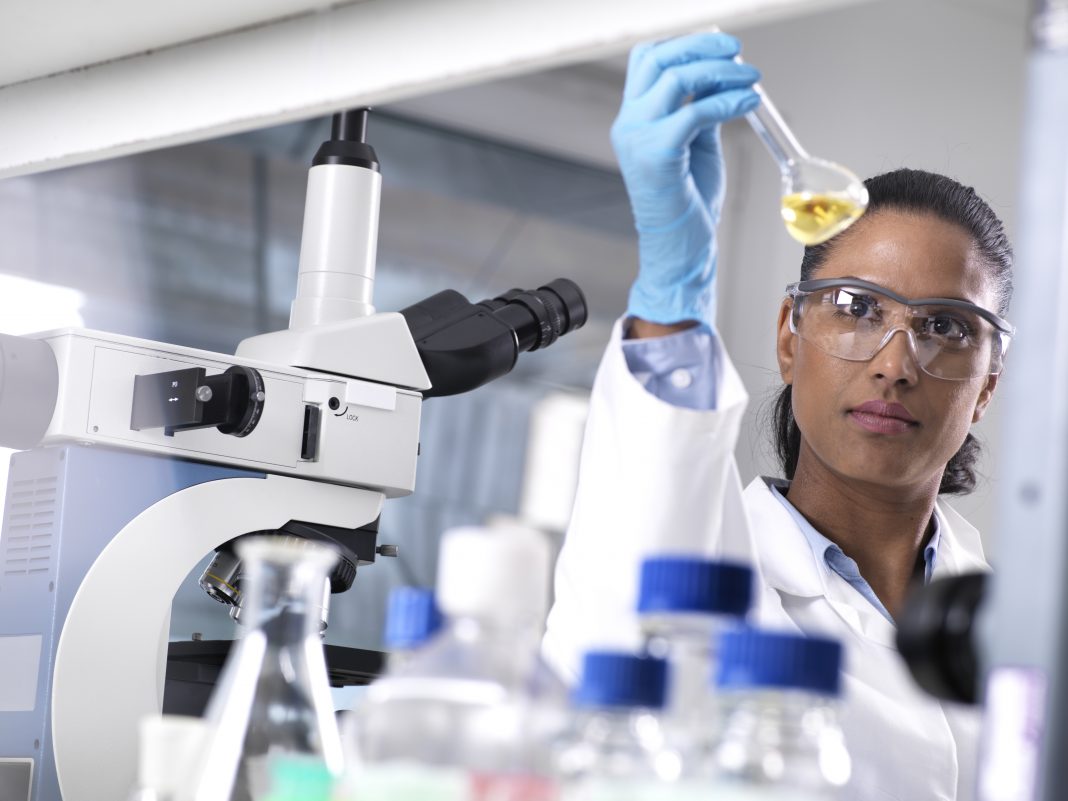 Biotechnology Research, female scientist mixing a chemical formula