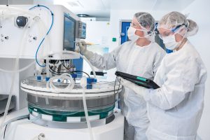 FinVector technicians operate the iCELLis, a Pall Biotech bioreactor