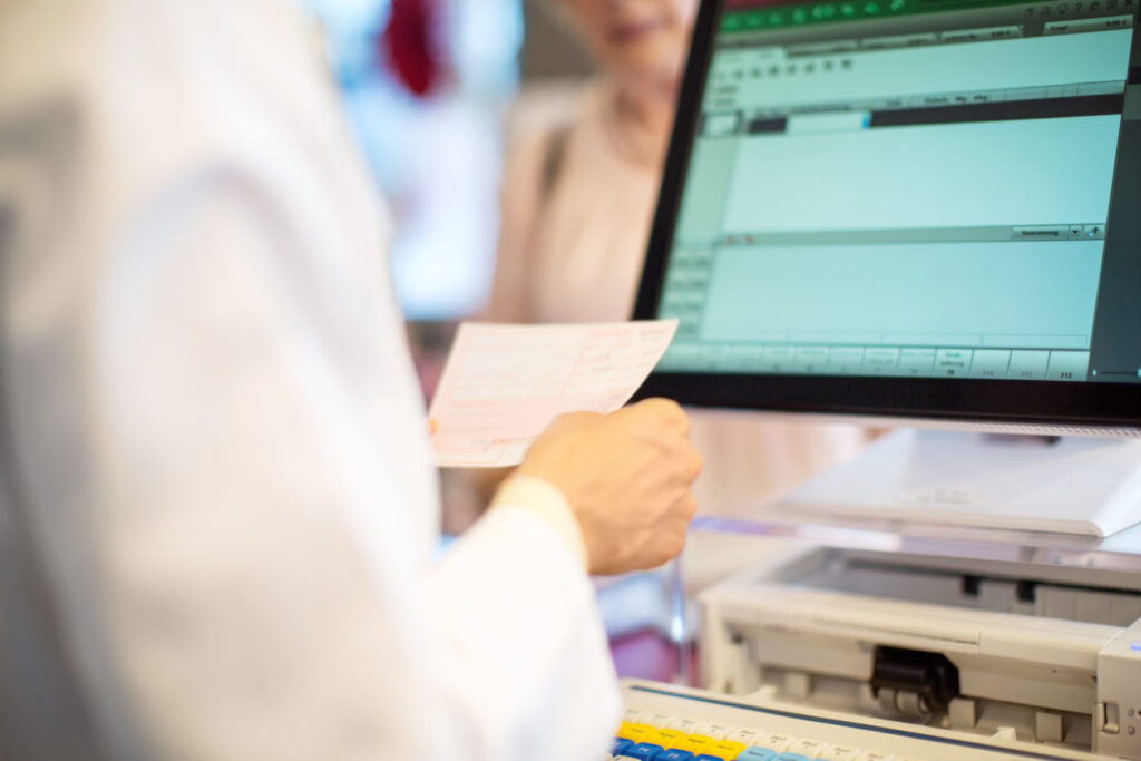Chemist searching medicine in the database