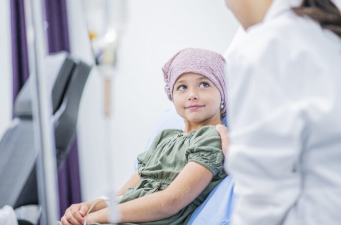 Smiling Little Girl With Cancer stock photo