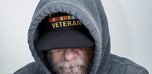 Vietnam War USA Military Veteran Wearing Hoody Looking Down