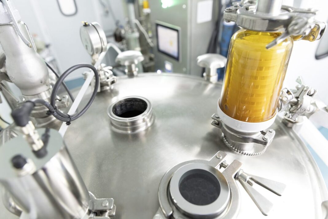 Modern fermenter in bright laboratory