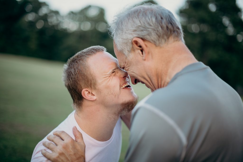 down syndrome boy with older man