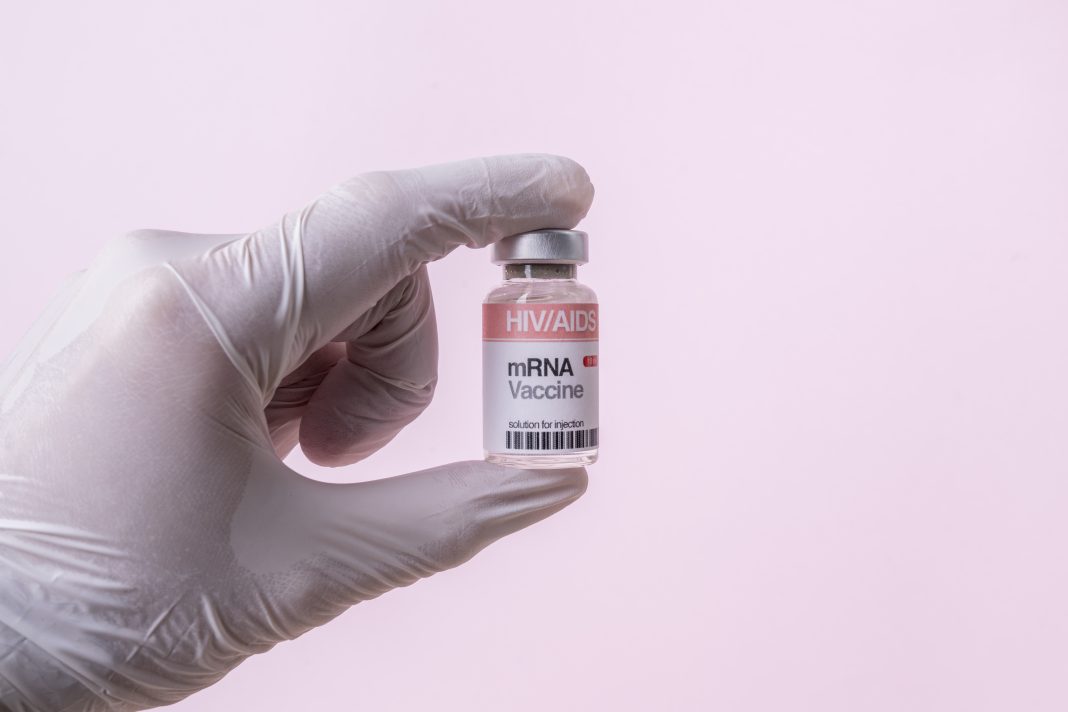 mRNA Vaccine Vial For HIV/AIDS On Pink Background