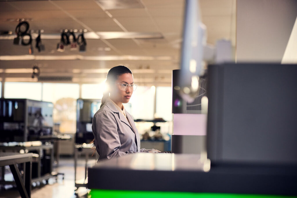 Scientist interacting with an Illumina NextSeq 2000