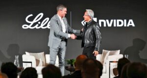 David A. Ricks and Jensen Huang shake hands