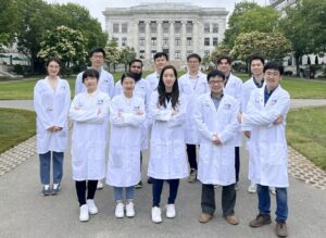 Wei Tao, PhD, professor at the Harvard Medical School (far right, first row) and his research team. [Wei Tao]