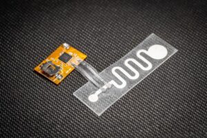 Unassembled integrated levodopa monitoring patch. [David Baillot (University of California, San Diego, San Diego, CA).]