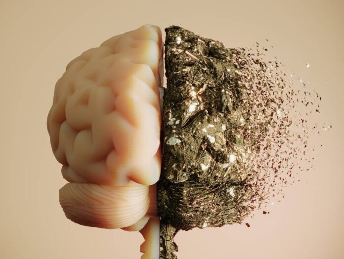 A 3D concept of a human brain where one side appears healthy and the other side disintegrates into fragments.
