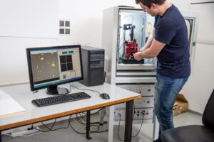 Placing samples into an atomic force microscope, a high-resolution type of scanning probe microscopy with demonstrated resolution on the order of fractions of a nanometer.