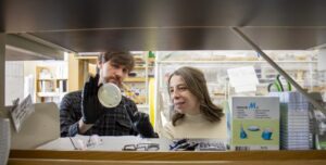 (From left) Roger Bataglioli and Hiba Baaziz in the lab. [Photo by Felicia Spencer for Virginia Tech.]