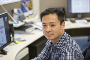 Associate Professor Pengyi Yang at his desk. [University of Sydney] 