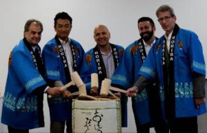 Members of the HORIBA team at the event participate in a traditional sake barrel opening ceremony as part of the launch [Credit: HORIBA].